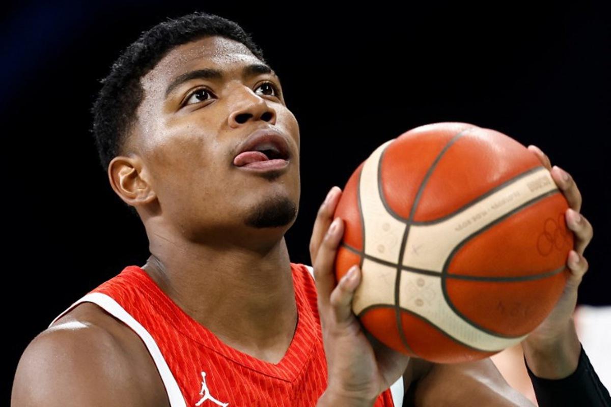 Japan's #08 Rui Hachimura takes a free throw in the men's preliminary round group B basketball match between Germany and Japan during the Paris 2024 Olympic Games at the Pierre-Mauroy stadium in Villeneuve-d'Ascq, northern France, on July 27, 2024.  Sameer Al-Doumy / AFP