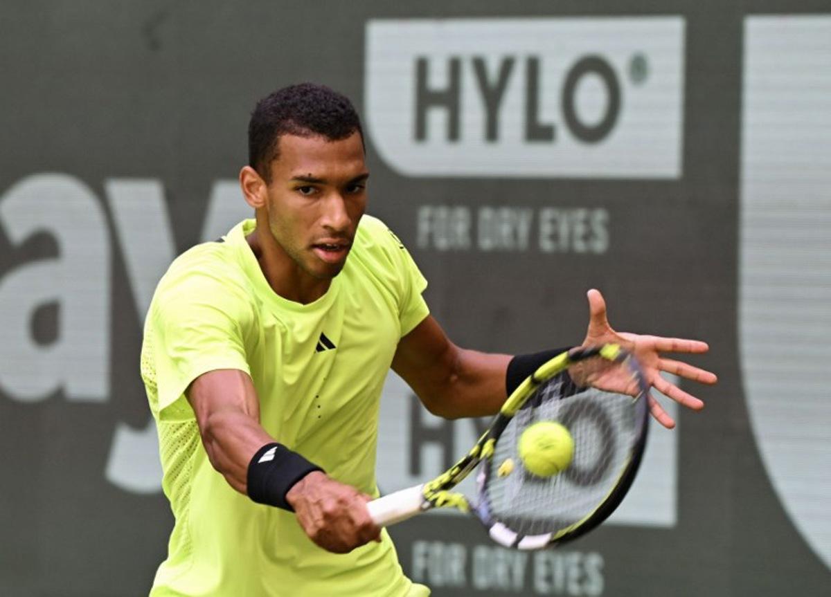 Canada's Felix Auger-Aliassime returns a ball to Russia's Karen Khachanov (not in picture) during their match at the ATP tennis tournament in Halle (Westfalen), western Germany, on June 19, 2025.  CARMEN JASPERSEN / AFP
