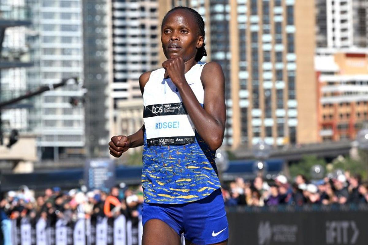 Kenya's Brigid Kosgei crosses the finish line in second place during the 2025 Sydney Marathon at the Opera House on August 31, 2025.  Saeed KHAN / AFP