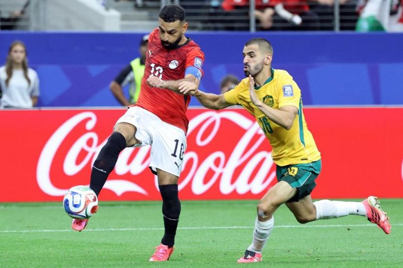 Egypt's forward #10 Mohamed Salah (L)  fights for the ball with Australia's defender #16 Aziz Behich during the 2026 World Cup round of 32 football match between Australia and Egypt at the Dallas Stadium in Arlington on July 3, 2026.   Thomas COEX / AFP