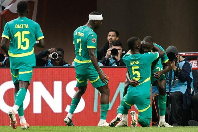 Senegal's midfielder #26 Pape Gueye (R) celebrates scoring his team's second goal with Senegal's midfielder #05 Idrissa Gueye (2R) during the Africa Cup of Nations (CAN) round of 16 football match between Senegal and Sudan at Grand Stadium in Tangiers on January 3, 2026.  Abdel Majid BZIOUAT / AFP