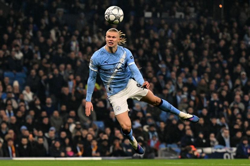 Manchester City's Norwegian striker #09 Erling Haaland dives to header the ball at goal in the opening seconds of the match, but the shot goes wide  during the UEFA Champions League football match between Manchester City and Galatasaray at the Etihad Stadium in Manchester, north west England, on January 28, 2026.  Oli SCARFF / AFP