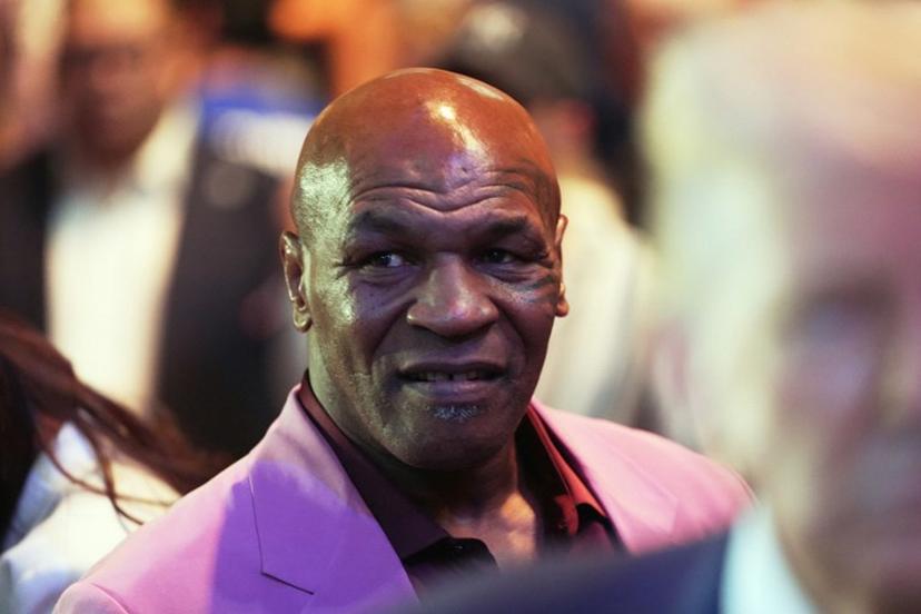 US President Donald Trump (R), and US former professional boxer Mike Tyson (L) attend a UFC 316 event, headlined by a rematch between Georgian mixed martial artist Merab Dvalishvili and US mixed martial artist Sean O'Malley at the Prudential Center in Newark, New Jersey on June 7, 2025.  Frank Franklin II / POOL / AFP