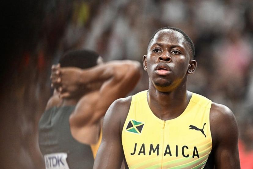 Jamaica's athlete Oblique Seville (R) reacts after competing in the men's 100m semi-final during the World Athletics Championships in Tokyo on September 14, 2025.  Jewel SAMAD / AFP