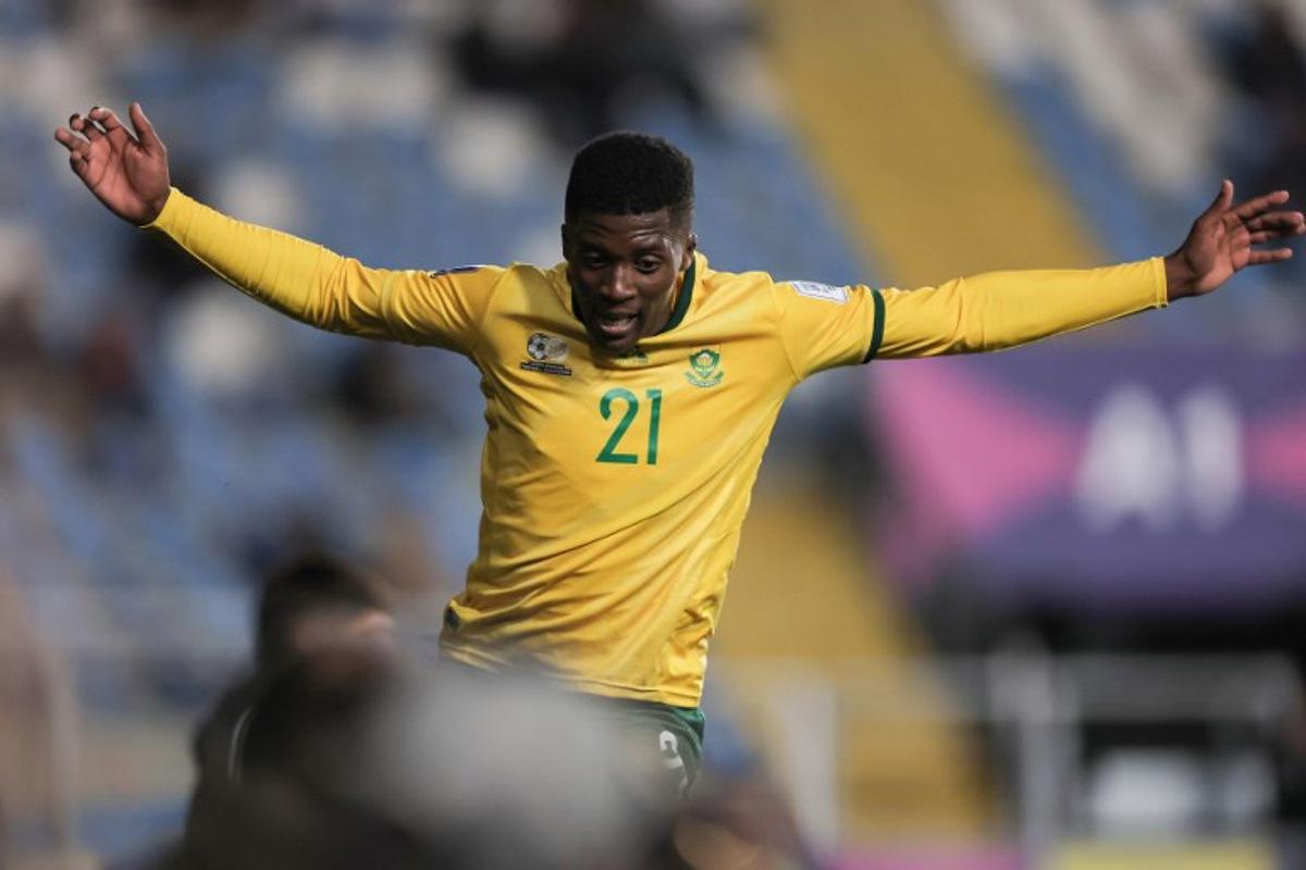 South Africa's forward #21 Siviwe Magidigidi celebrates scoring his team's fourth goal during the 2025 FIFA U-20 World Cup football match between South Africa and New Caledonia at El Teniente Stadium in Rancagua, Chile on October 2, 2025.  Javier TORRES / AFP