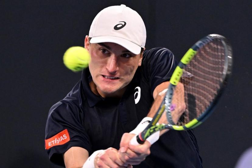 Belgium's Raphael Collignon hits a return to Bulgaria's Grigor Dimitrov during their men's singles match at the Brisbane International tennis tournament in Brisbane on January 8, 2026.  William WEST / AFP