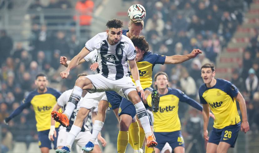 Charleroi's Kevin Van Den Kerkhof, Union's Kevin Mac Allister and Union's Louis Patris fight for the ball during a soccer game between Sporting Charleroi and Royale Union Saint-Gilloise, a first leg 1/2 final game in the Croky Cup Belgian cup competition, Wednesday 04 February 2026 in Charleroi. BELGA PHOTO VIRGINIE LEFOUR
