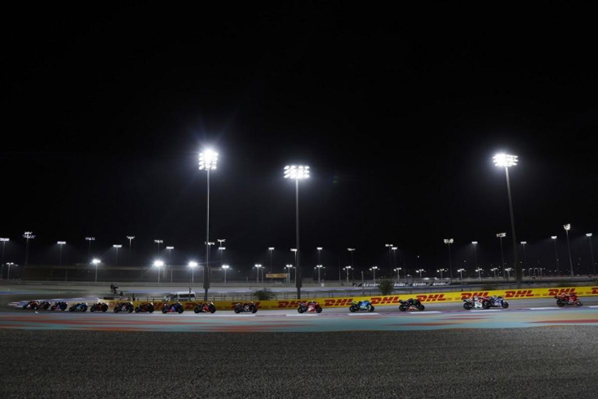 Riders compete during the Qatar MotoGP Grand Prix at the Lusail International Circuit in Lusail, north of Doha, on April 13, 2025.  Karim JAAFAR / AFP