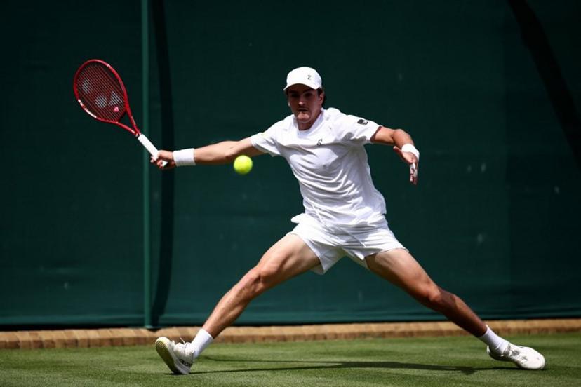 Brazil's Joao Fonseca returns to Spain's Roberto Bautista Agut during their men's singles first round tennis match on the first day of the 2026 Wimbledon Championships at The All England Lawn Tennis and Croquet Club in Wimbledon, southwest London, on June 29, 2026.  Henry NICHOLLS / AFP