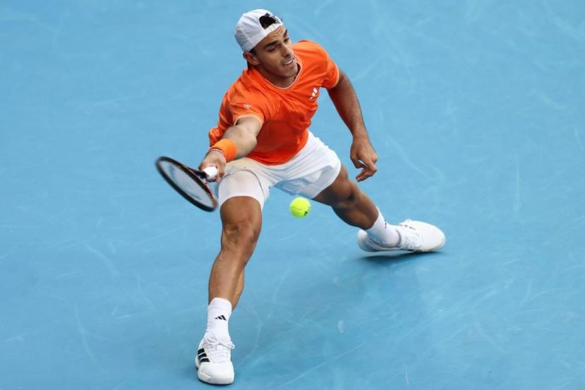 Argentina's Francisco Cerundolo hits a shot against Germany's Alexander Zverev during their men's singles match on day eight of the Australian Open tennis tournament in Melbourne on January 25, 2026.  IZHAR KHAN / AFP