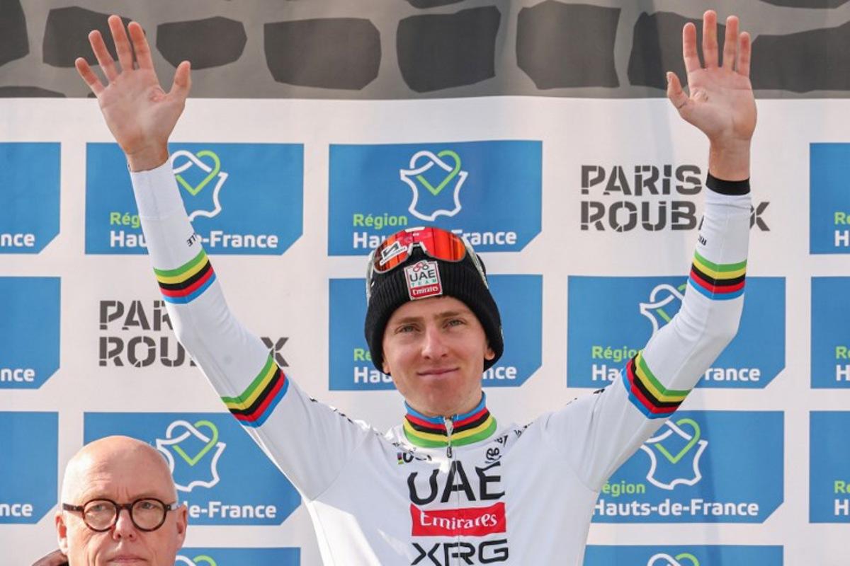 Second placed UAE Team Emirate's Slovenian rider Tadej Pogacar celebrates on the podium of the 122nd edition of the Paris-Roubaix one-day classic cycling race, 259,2 km between Compiegne and Roubaix, northern France on April 13, 2025.  Francois LO PRESTI / AFP