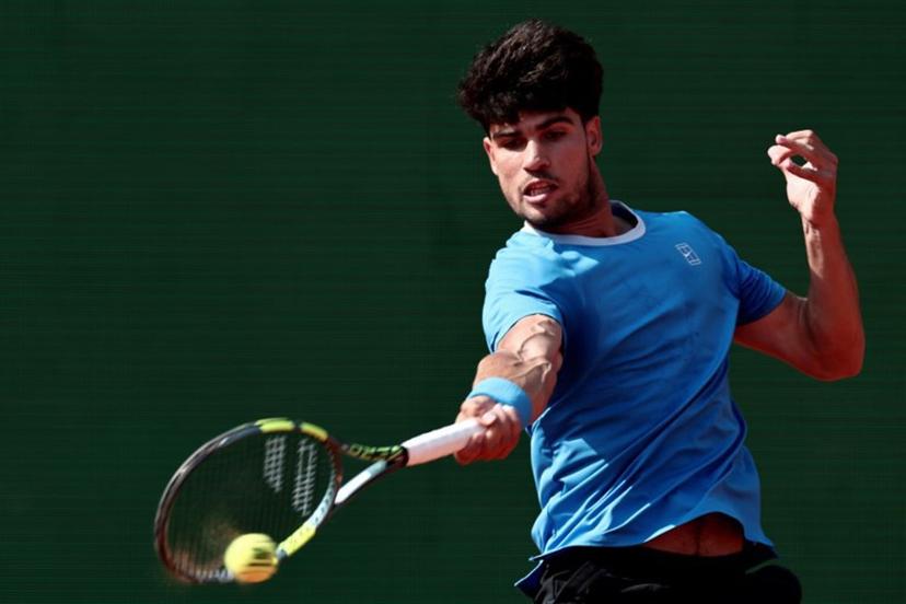 Spain's Carlos Alcaraz plays a forehand return to Monaco's Valentin Vacherot during the Monte Carlo ATP Masters Series Tournament semi-final tennis match on Court Rainier III at the Monte-Carlo Country Club in Roquebrune-Cap-Martin, south-eastern France on April 11, 2026.  Thibaud MORITZ / AFP