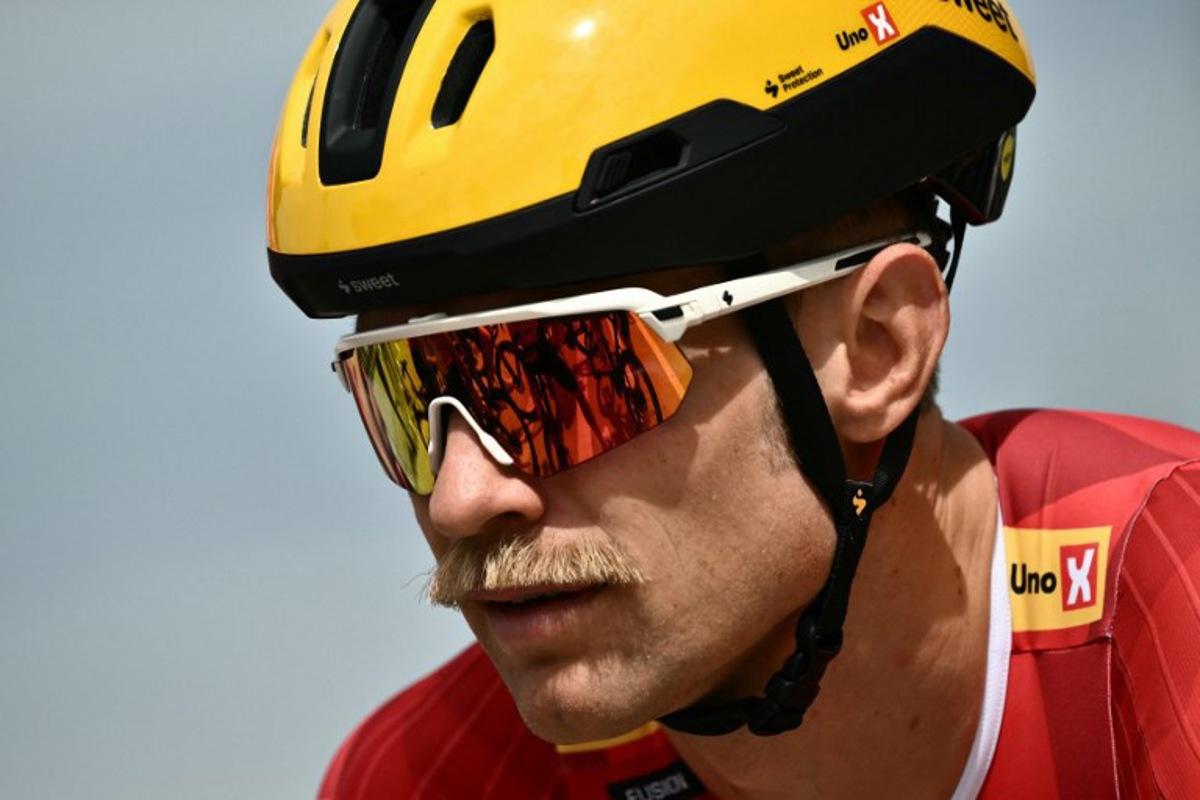Uno-X Mobility team's Danish rider Magnus Cort Nielsen awaits the start of the 1st stage of the 112th edition of the Tour de France cycling race, 184.9 km starting and finishing in Lille Metropole, northern France, on July 5, 2025.  Marco BERTORELLO / AFP
