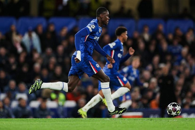 Chelsea's English defender #23 Trevoh Chalobah runs with the ball during the UEFA Champions League round of 16 second leg football match between Chelsea FC and Paris Saint-Germain (PSG) at Stamford Bridge, west London on March 17, 2026.  Adrian Dennis / AFP
