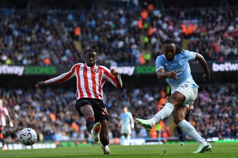 Manchester City's Ghanaian midfielder #42 Antoine Semenyo (R) shoots to score their fourth goal during the English Premier League football match between Manchester City and Sunderland at the Etihad Stadium in Manchester, north west England, on September 20, 2026.  PETER POWELL / AFP
