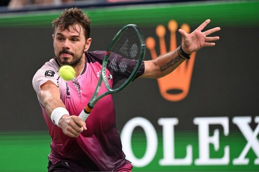 Switzerland's Stan Wawrinka hits a return to Hungary's Fabian Marozsan in their men's singles match at the Shanghai Masters tennis tournament in Shanghai on October 1, 2025.  Jade Gao / AFP