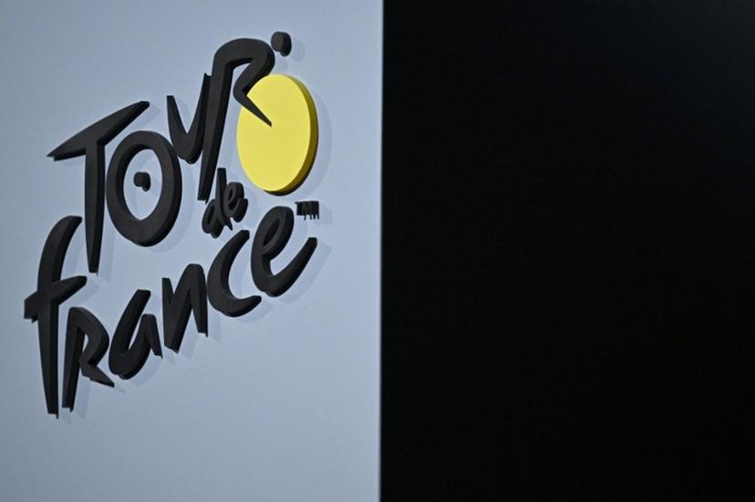 The Tour de France cycling race logo is pictured during the official unveiling of both men and women 2025 editions of the Tour de France routes in Paris on October 29, 2024. The Tour de France Men's race will start in Lille, northern France on July 5, 2025 (July 5 - 27) and the women's race (July 26 - August 3) will be launched in Brittany. JULIEN DE ROSA / AFP