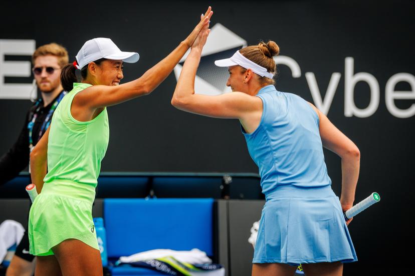 Belgian Elise Mertens (R) and her Chinese partner Shuai Peng celebrate during a doubles tennis match against Taiwanese-Japanese pair Wu-Hozumi, in the quarterfinals of the women doubles at the Australian Open, Melbourne Park, Melbourne on Wednesday 28 January 2026. Mertens - Zhang won the game. BELGA PHOTO PATRICK HAMILTON  --- BENELUX ONLY   ---