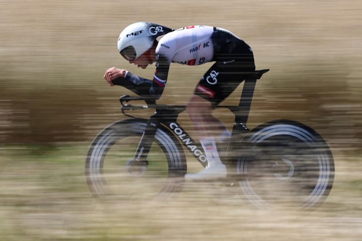 UAE Team Emirates XRG's Slovenian rider Tadej Pogačar cycles during the 4th stage of the 77th edition of the Criterium du Dauphine cycling race, a 17,4 km individual time trial between Charmes-sur-Rhône and Saint-Péray, on June 11, 2025.  Anne-Christine POUJOULAT / AFP