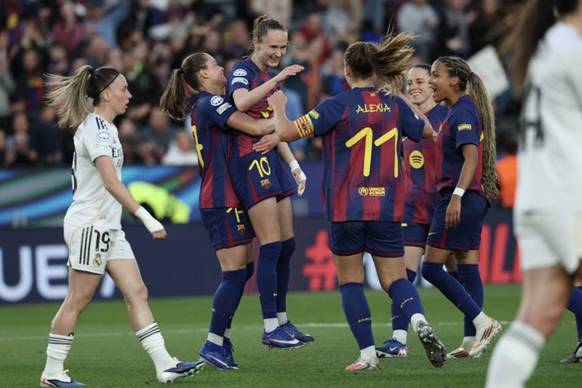 Barcelona's Norwegian forward #10 Caroline Graham Hansen (C) celebrates after scoring their fifth goal during the UEFA Women's Champions League quarter final second leg football match between FC Barcelona and Real Madrid CF at the Camp Nou stadium in Barcelona on April 2, 2026.  Lluis GENE / AFP