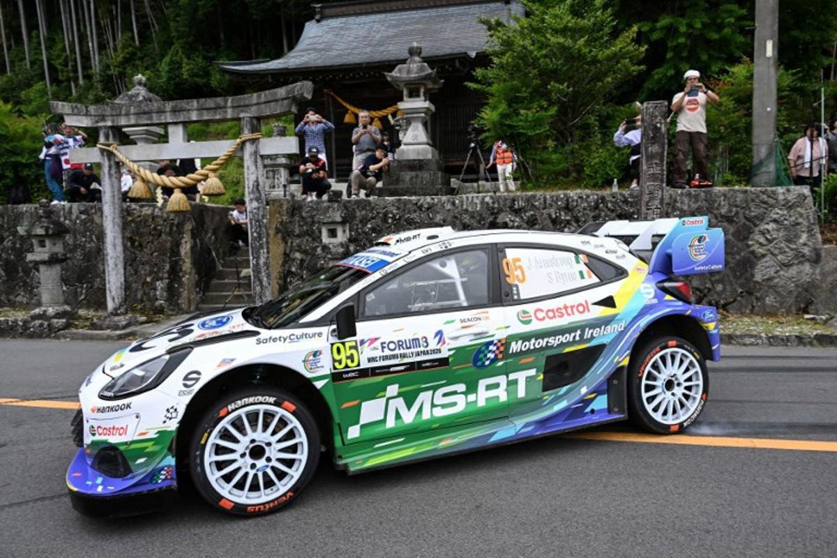 Jon Armstrong of Ireland and his co-driver Shane Byrne of Ireland drive their Ford Puma Rally1 during the SS16 Lake Mikawako section of the Rally Japan, the 7th round of FIA World Rally Championships, in Toyota city, Aichi prefecture on May 31, 2026.  Toshifumi KITAMURA / AFP