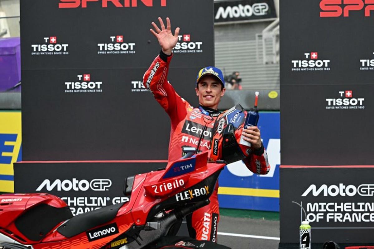 Ducati Lenovo Team's Spanish MotoGP rider Marc Marquez waves ahead of the sprint race, as part of the France Moto GP Grand Prix, at Le Mans Circuit on May 10, 2025.  LOIC VENANCE / AFP