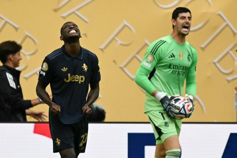 Juventus' French forward #20 Randal Kolo Muani reacts after failing to score next to Real Madrid's Belgian goalkeeper #01 Thibaut Courtois during the FIFA Club World Cup 2025 round of 16 football match between Spain's Real Madrid and Italy's Juventus at the Hard Rock Stadium in Miami on July 1, 2025.  CHANDAN KHANNA / AFP