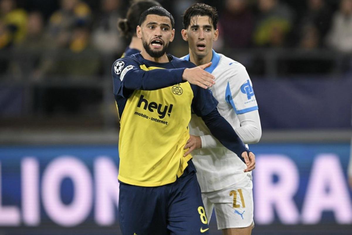 Union St-Gilloise's Algerian midfielder #08 Adem Zorgane reacts during the UEFA Champions League, league phase day 6, football match between Royale Union Saint-Gilloise (BEL) and Olympique de Marseille (FRA), at the RSC Anderlecht Stadium in Brussels, on December 9, 2025.  NICOLAS TUCAT / AFP