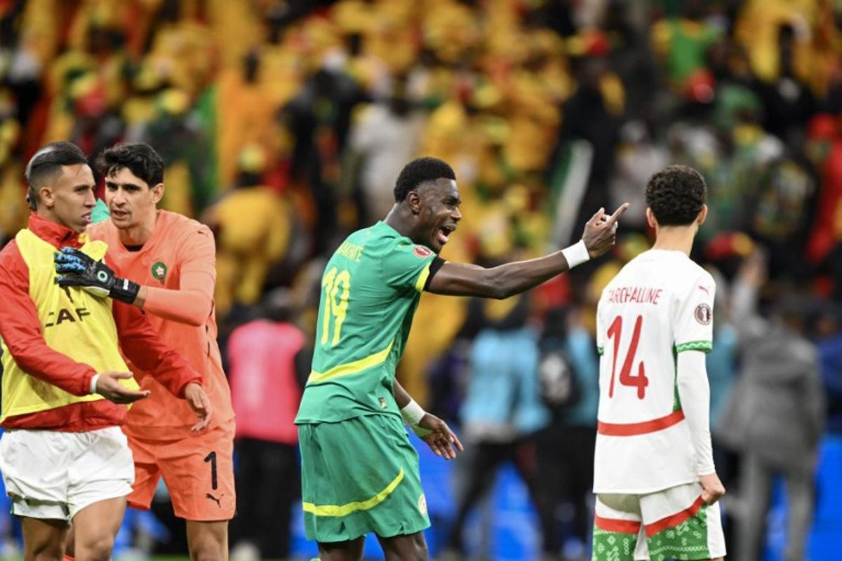 Senegal's defender #19 Moussa Niakhate reacts during the Africa Cup of Nations (CAN) final football match between Senegal and Morocco at the Prince Moulay Abdellah Stadium in Rabat on January 18, 2026.   SEBASTIEN BOZON / AFP