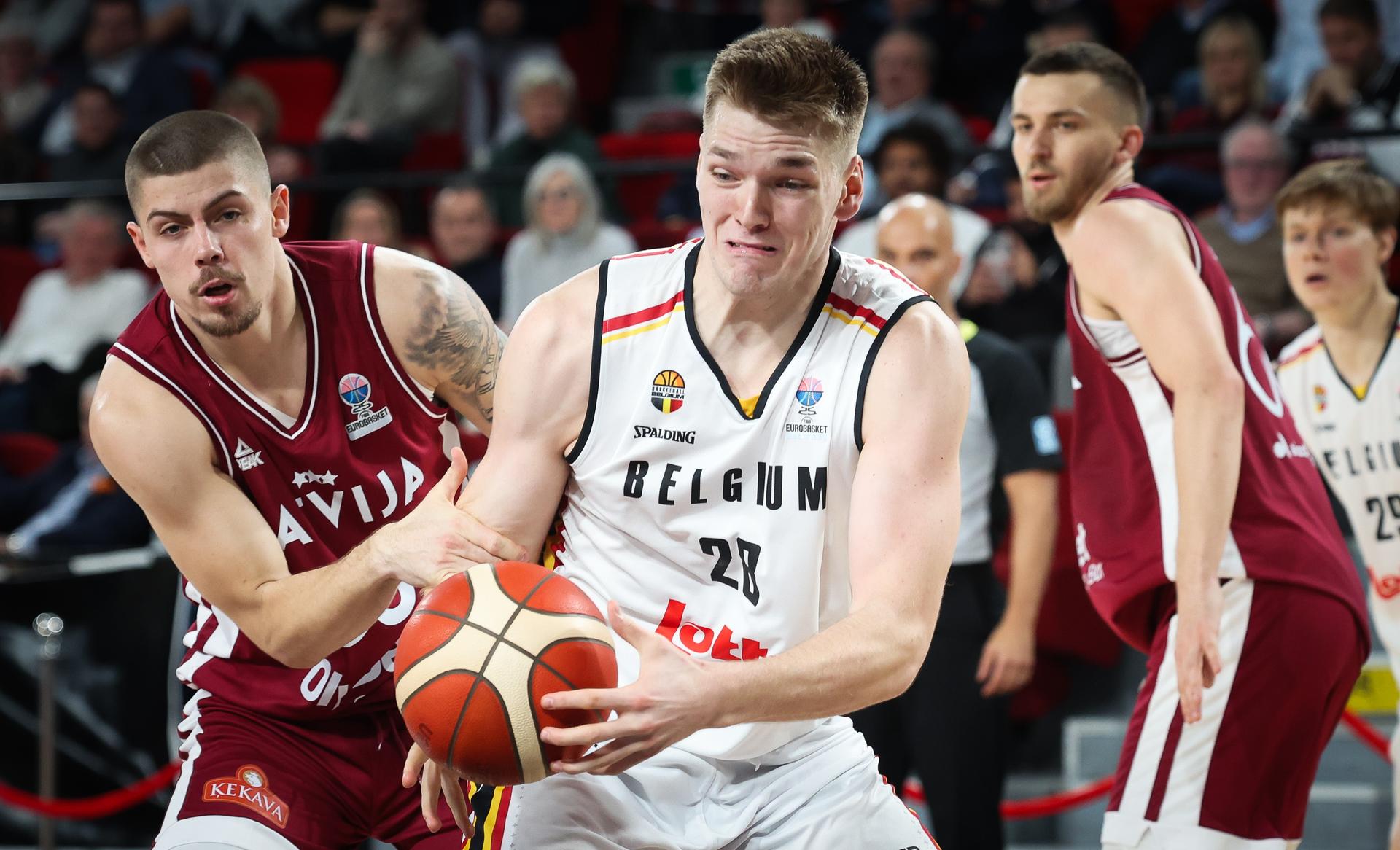 Latvian Kristaps Kilps and Belgium's Thijs De Ridder fight for the ball during a basketball match between Belgium's national team Belgian Lions and Latvia, Monday 25 November 2024 in Charleroi, game 4/6 in the group stage of the qualifications for the Eurobasket 2025 European championships. BELGA PHOTO VIRGINIE LEFOUR