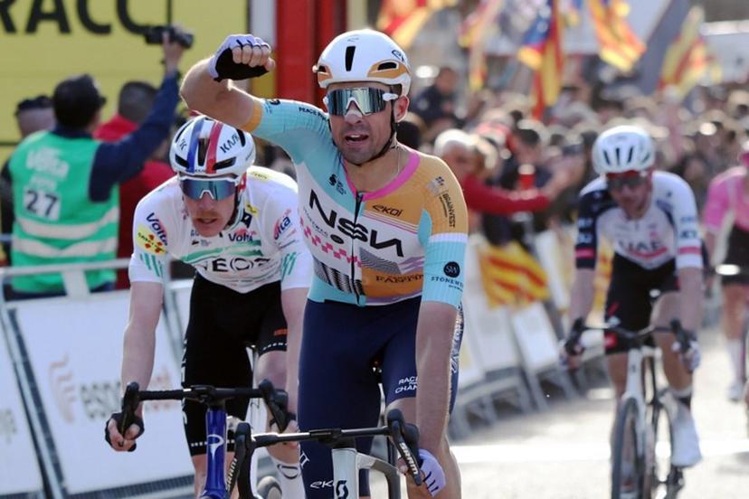 Team NSN Cycling Team's Welsh rider Ethan Vernon (C) celebrates ahead of Team Ineos' French rider Dorian Godon (L), after winning the 4th stage of the 2026 Volta a Catalunya cycling tour of Catalonia, a 151 km race between Mataro and  Camprodon, on March 26, 2026.  Josep LAGO / AFP