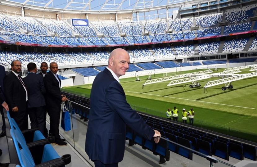 This handout picture released by the Federation Royale Marocaine De Football (FRMF) on September 20, 2025, shows FIFA President Gianni Infantino looking at the stadium during a tour of the Grand stade of Tangier.  Federation Royale Marocaine De Football / AFP