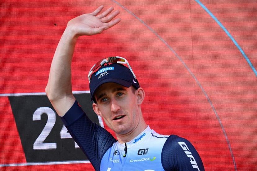 Team Jayco-AlUla's Eddie Dunbar celebrates on the podium winning the stage 11 of the Vuelta a Espana, a 166.5 km race between Padron and Padron, on August 28, 2024.    MIGUEL RIOPA / AFP