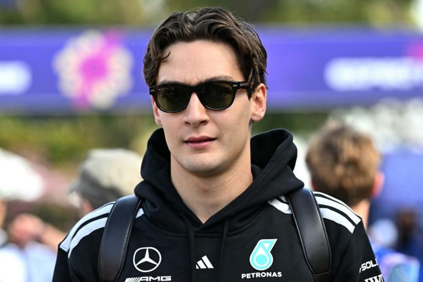 Mercedes' British driver George Russell walks through the paddock ahead of the Formula One Australian Grand Prix at the Albert Park Circuit in Melbourne on March 8, 2026.   Paul Crock / AFP