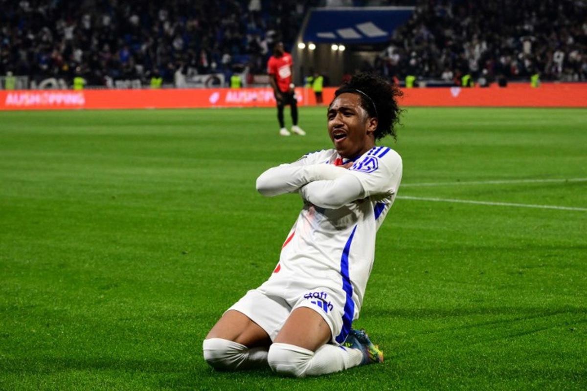 Lyon's Belgian forward #11 Malick Fofana celebrates after scoring his team's first goal during the French L1 football match between Olympique Lyonnais (OL) and Stade Rennais FC (Rennes) at The Groupama Stadium in Decines-Charpieu, central-eastern France on April 26, 2025.  OLIVIER CHASSIGNOLE / AFP