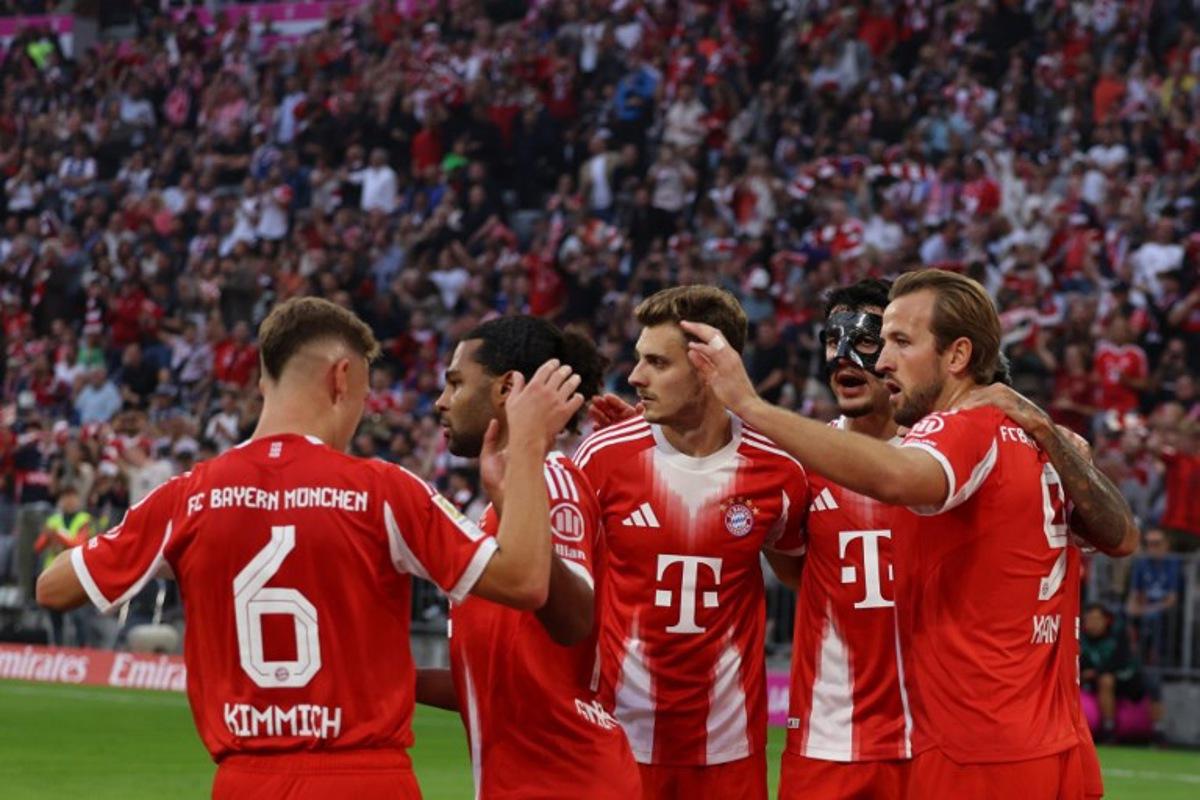 (L-R) Bayern Munich's German midfielder #06 Joshua Kimmich, Bayern Munich's German forward #07 Serge Gnabry, Bayern Munich's Croatian defender #44 Josip Stanisic, Bayern Munich's German midfielder #45 Aleksandar Pavlovic and Bayern Munich's English forward #09 Harry Kane celebrate after the 4-0 goal during the German first division Bundesliga football match between FC Bayern Munich and HSV Hamburg in Munich, southern Germany, on September 13, 2025.  Alexandra BEIER / AFP