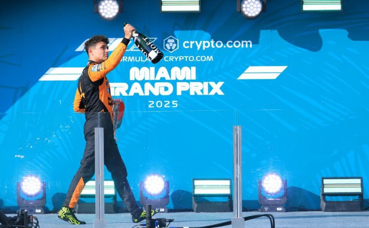 McLaren's British driver Lando Norris celebrates his second place finish on the podium during the 2025 Miami Formula One Grand Prix at Miami International Autodrome in Miami Gardens, Florida, on May 4, 2025.   CHARLY TRIBALLEAU / AFP