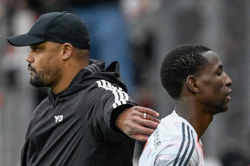 Bayern Munich's Belgian head coach Vincent Kompany (L) greets Bayern Munich's Senegalese forward #11 Nicolas Jackson after he was send off during the German first division Bundesliga football match between Bayer 04 Leverkusen and FC Bayern Munich in Leverkusen, western Germany on March 14, 2026.  INA FASSBENDER / AFP