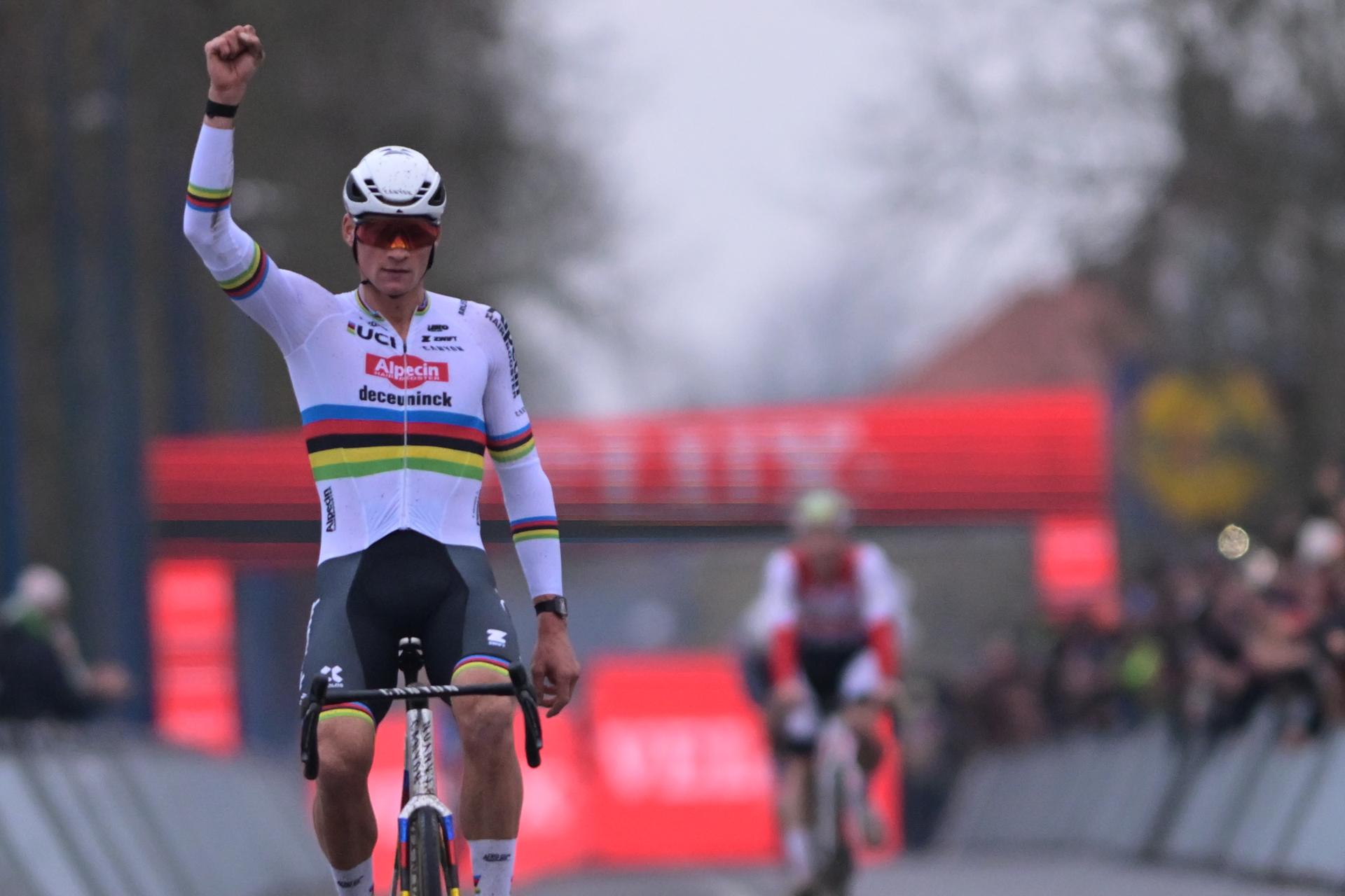 Dutch Mathieu Van Der Poel celebrates as he crosses the finish line to win the men's elite race of the 6th stage (out of 12) of the world cup cyclocross, in Koksijde Sunday 21 December 2025. BELGA PHOTO DAVID PINTENS