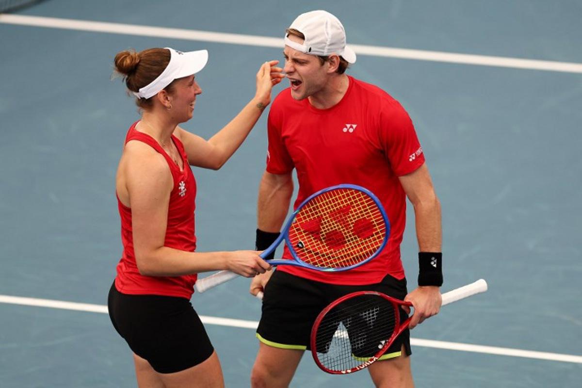 Belgium's Zizou Bergs (R) and Elise Mertens celebrate after winning their mixed double games against Canada's Cleeve Harper and Victoria Mboko at the United Cup tennis tournament on Ken Rosewall Arena in Sydney on January 6, 2026.  Izhar KHAN / AFP