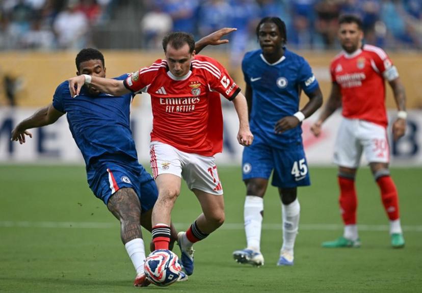 Chelsea's English defender #24 Reece James and Benfica's Turkish midfielder #17 Muhammed Akturkoglu fight for the ball during the FIFA Club World Cup 2025 round of 16 football match between Portugal's Benfica and England's Chelsea at the Bank of America Stadium in Charlotte on June 28, 2025.  Paul ELLIS / AFP