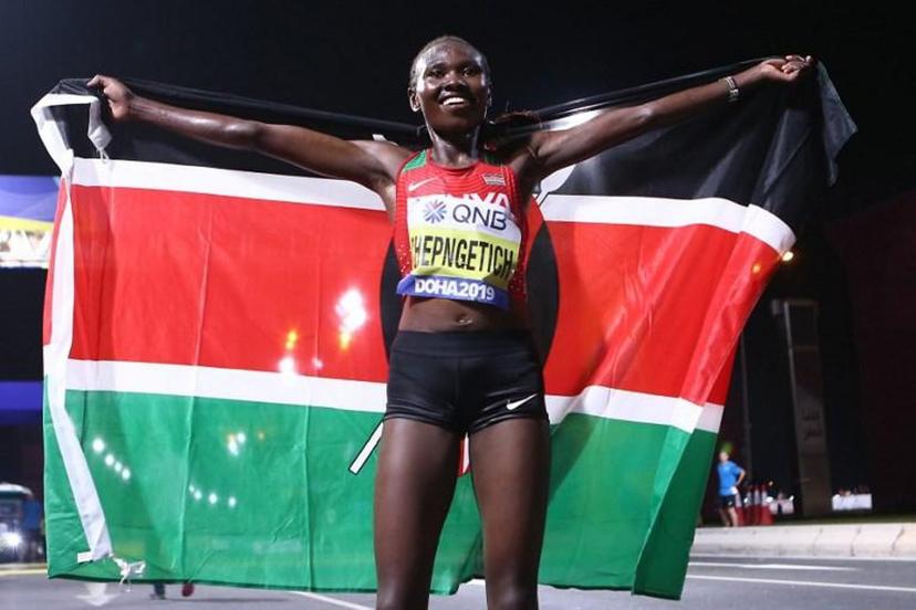 Kenya's Ruth Chepngetich celebrates after winning the Women's Marathon at the 2019 IAAF World Athletics Championships in Doha on September 27, 2019.  MUSTAFA ABUMUNES / AFP