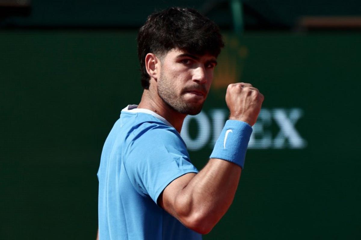 Spain's Carlos Alcaraz celebrates a point against Monaco's Valentin Vacherot during the Monte Carlo ATP Masters Series Tournament semi-final tennis match on Court Rainier III at the Monte-Carlo Country Club in Roquebrune-Cap-Martin, south-eastern France on April 11, 2026.  Thibaud MORITZ / AFP