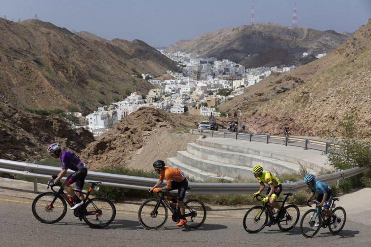(L to R) Burgos BH's rider Victor Langellotti, Euskatel-Euskadi's Antonio Angulo Sampedro, Bingoal Pauwels Sauces WB's Johan Meens, and Astana Qazaqstan Team's Harold Martin Lopez Granizo ride during the sixth stage of the Oman Tour, between al-Mouj Muscat and Matrah Corniche, in Muscat on February 15, 2022.  Thomas SAMSON / AFP