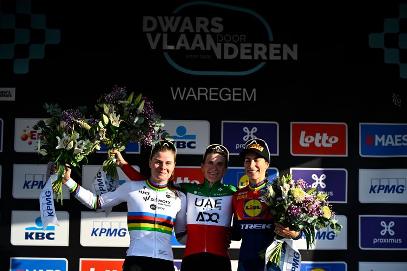Belgian Lotte Kopecky of SD Worx-Protime, Italian Elisa Longo Borghini of UAE Team ADQ and Italian Elisa Balsamo of Lidl-Trek celebrate on the podium of the women elite race of the 'Dwars Door Vlaanderen' cycling event, 128,5km from and to Waregem, Wednesday 02 April 2025. BELGA PHOTO JASPER JACOBS