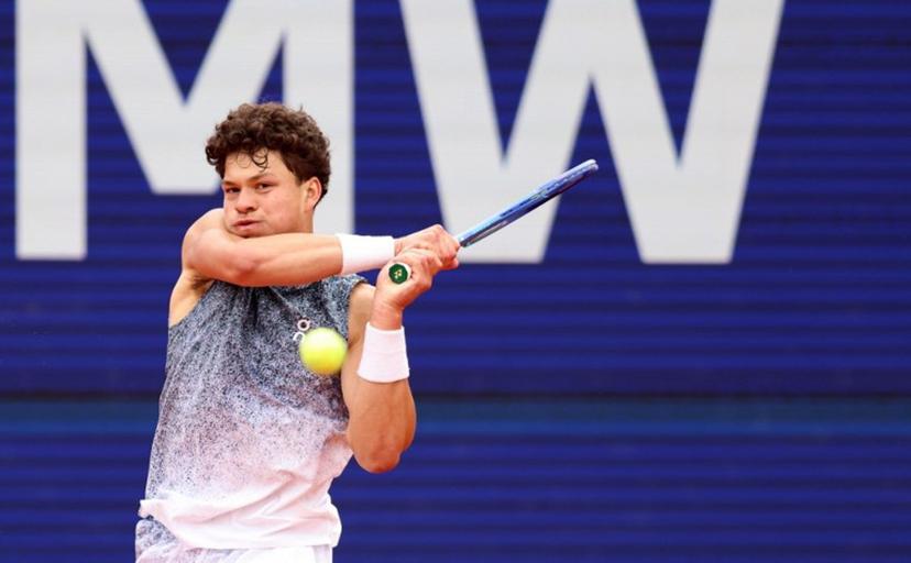 US' Ben Shelton returns the ball to Italy's Flavio Cobolli (not in picture) during the men's singles final match at the ATP Munich Open tennis tournament in Munich, southern Germany on April 19, 2026.   Alexandra BEIER / AFP