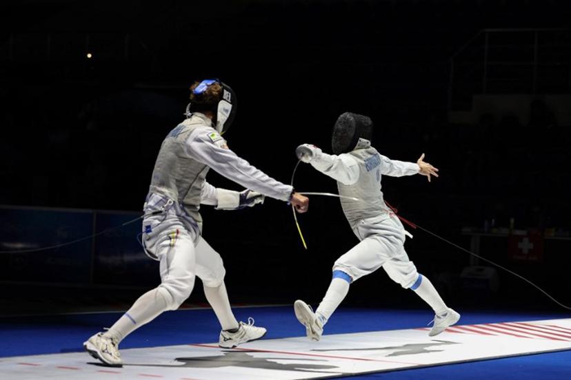 Individual Neutral Athlete Kirill Borodachev (R) and Belgium's Stef Van Campenhout compete in their men's foil individual bout during the FIE Fencing World Championships in Tbilisi on July 23, 2025.  Giorgi ARJEVANIDZE / AFP