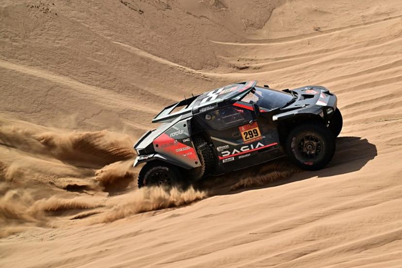 The Dacia Sandriders's Qatari driver Nasser Al‑Attiyah and Belgian co‑pilot Fabian Lurquin compete in Stage 12 of the 48th edition of the Dakar Rally 2026, between al-Henakiyah and Yanbu, Saudi Arabia, on January 16, 2026.  Giuseppe CACACE / AFP