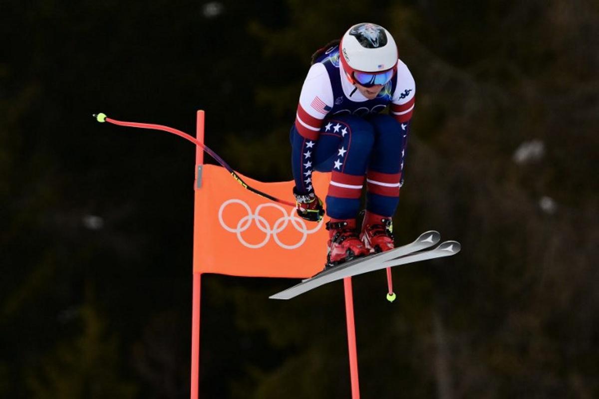 US' Breezy Johnson competes in the downhill run of the women's team combined event during the Milano Cortina 2026 Winter Olympic Games at the Tofane Alpine Skiing Centre in Cortina d'Ampezzo on February 10, 2026.  Stefano RELLANDINI / AFP