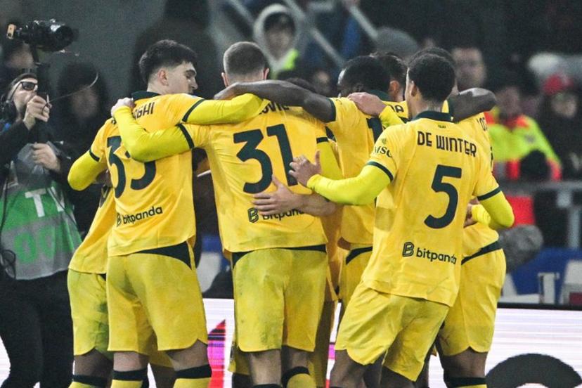 AC Milan's French forward #18 Christopher Nkunku (unseen) celebrates with teammates after scoring a penalty during the Italian Serie A football match between Bologna and AC Milan at the Renato Dall'Ara stadium in Bologna on February 3, 2026.  Andreas SOLARO / AFP